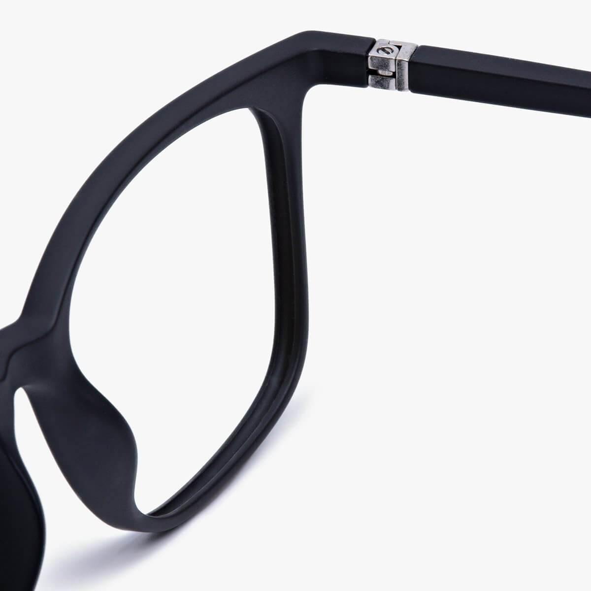 Close-up of Fyn Black glasses with sleek matte black frame