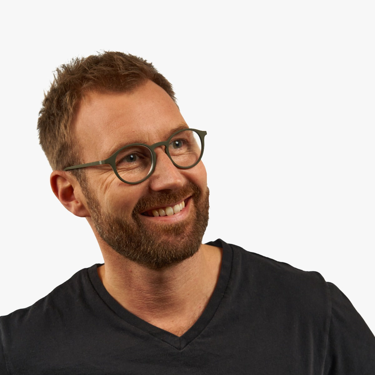Person wearing Læsø Dark Army glasses with round frames