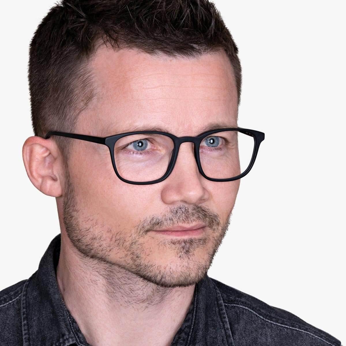 mens-ebeltoft-black_blue-light-glasses_male-model-1.jpg?v=1771423885&width=1200